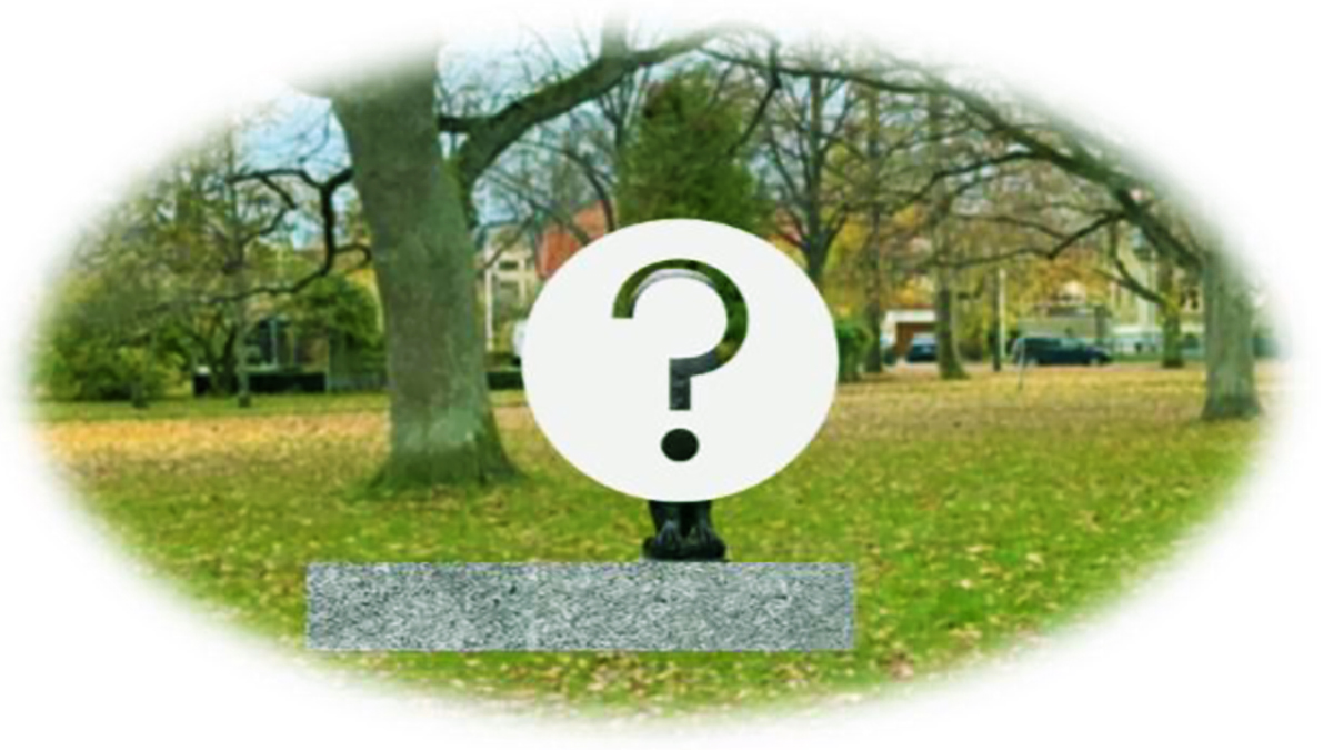 Staty i en park, statyn är gömd bakom ett frågetecken